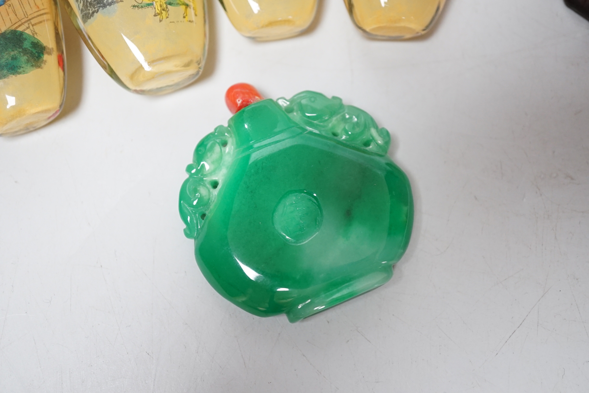 A group of Chinese snuff bottles, tallest 8.5cm including stopper
